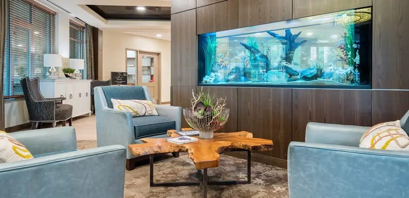 Interior common area with seating and aquarium