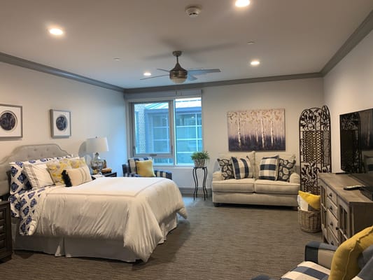 A well-furnished private resident room in a senior living facility