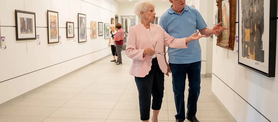 Residents enjoying art in a gallery space