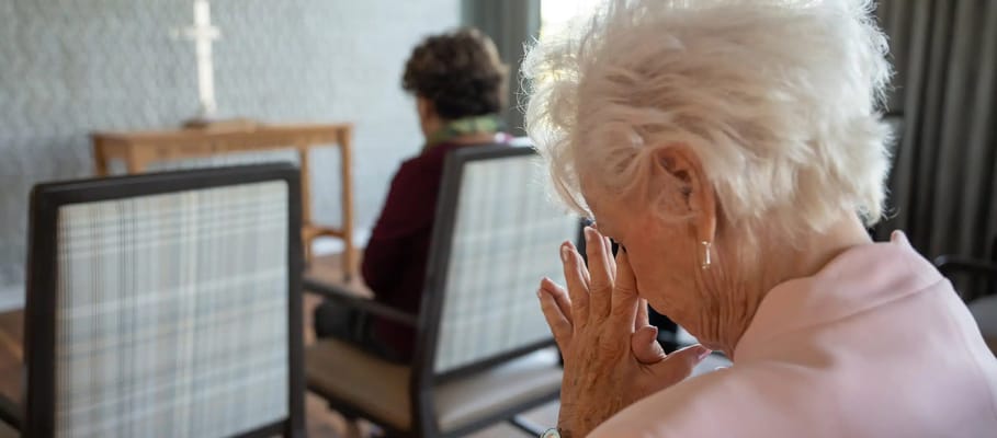 Two senior residents in a quiet moment of reflection
