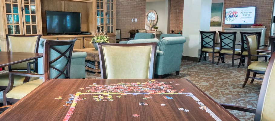 Common area with puzzle pieces on a table