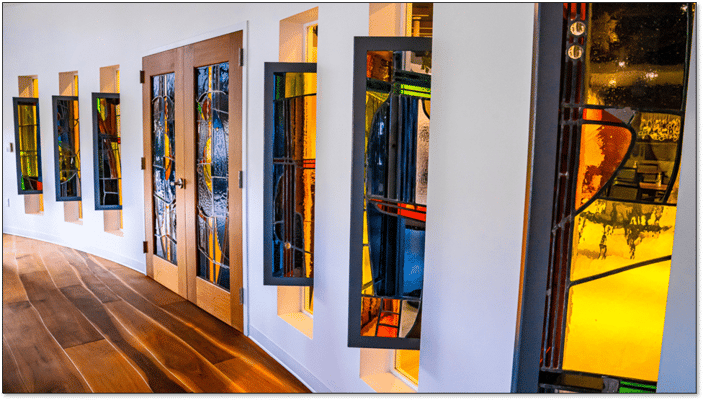 Colorful stained glass windows in a hallway