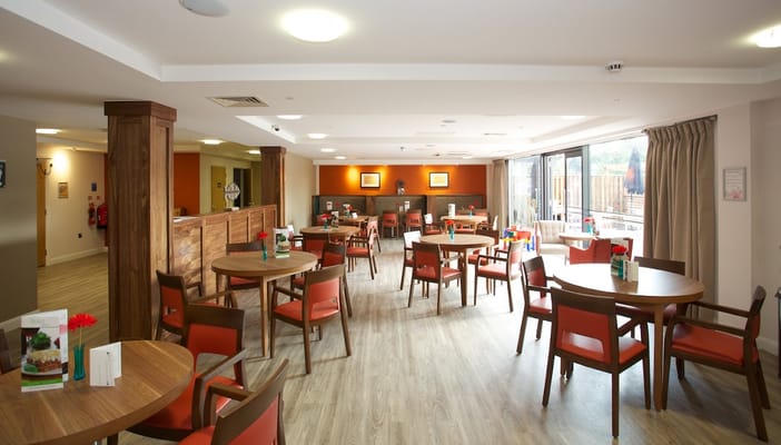 Bright dining area with tables and chairs