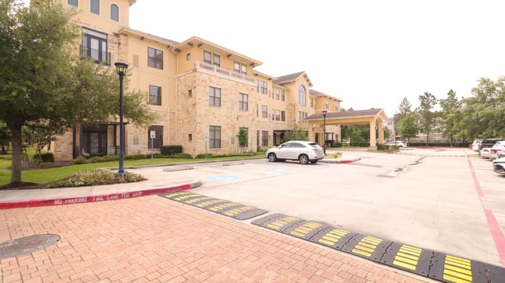 Parking area and entrance of The Solana Vintage Park senior living facility.