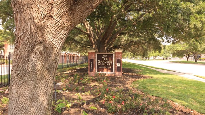 Sign indicating The Gardens of Bellaire assisted living facility.