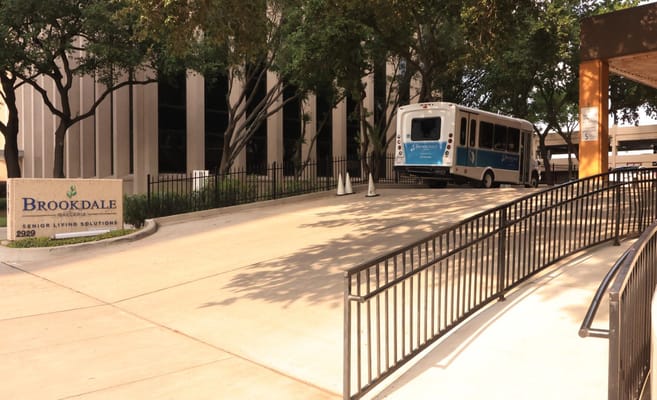 Exterior view of Brookdale Galleria entrance with transport van
