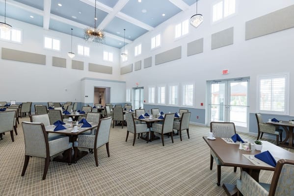 Interior view of a dining room with tables set