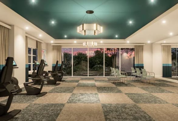 Interior view of a fitness room with exercise equipment