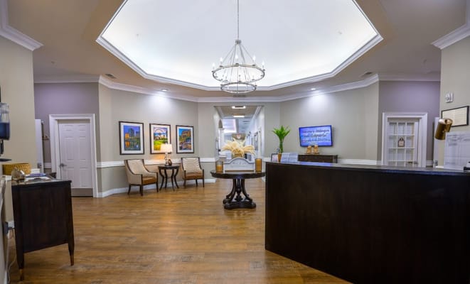 Modern lobby area with seating and reception desk