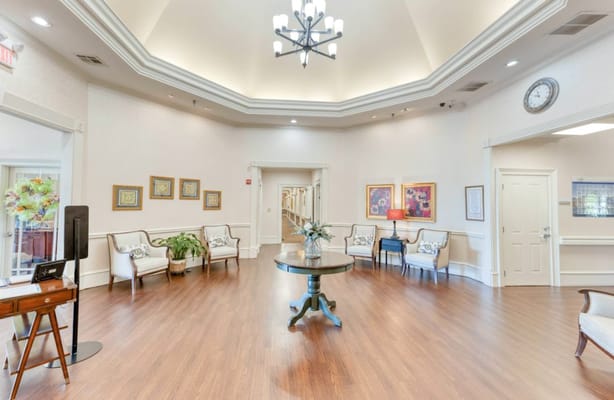 A bright lobby area with comfortable seating and decorative art