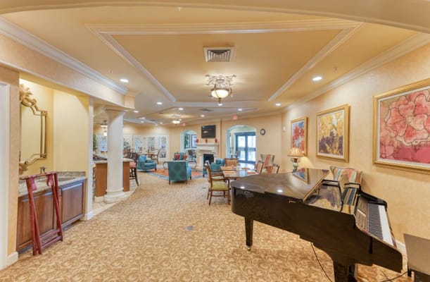 Cozy common area featuring a piano and seating arrangements.