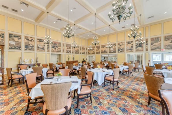 Bright dining room with elegant decor and tables set for meals