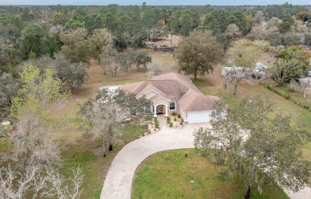 Aerial view of Aliviya Rose Manor surrounded by nature
