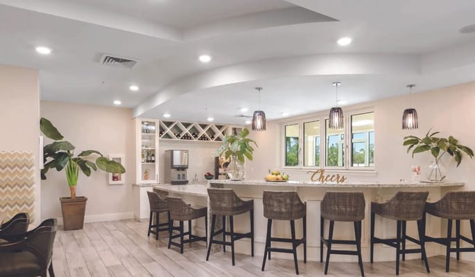 Bright common area with a stylish bar and seating