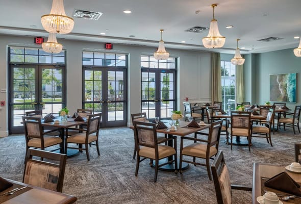 Elegant dining room setup with tables and chairs