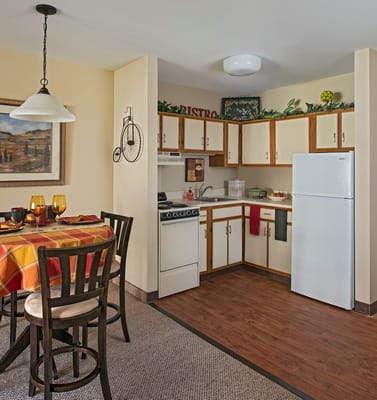 Cozy kitchen area with a dining table and appliances