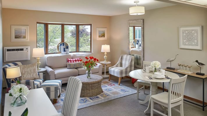 Cozy and inviting resident room with seating area