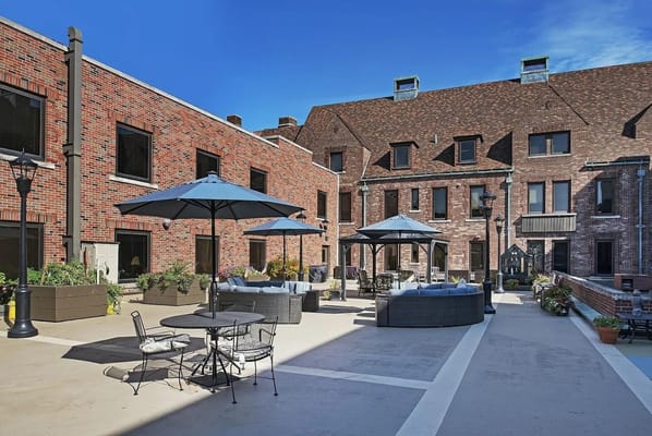 Outdoor patio area with seating and umbrellas