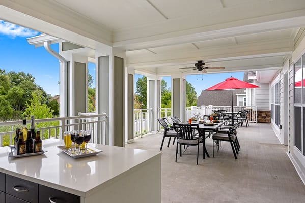 Outdoor dining area with tables and umbrellas