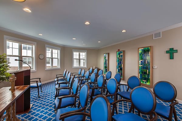 Interior view of a common area with blue chairs