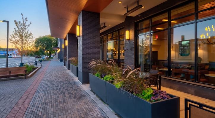 Paved walkway alongside the facility with modern architecture