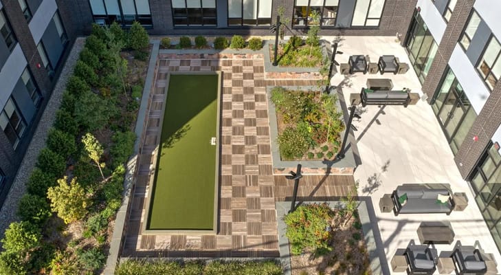 Aerial view of a landscaped outdoor space with seating