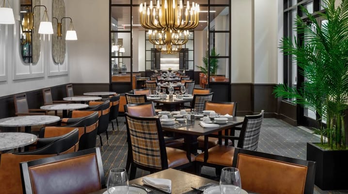 Elegant dining area with tables set for a meal