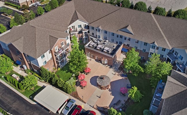Aerial view of a senior living facility with outdoor space