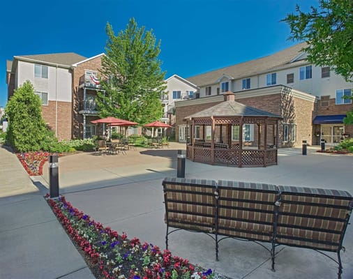 Outdoor courtyard with seating and gazebo