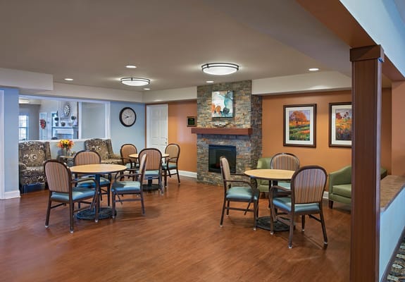 Bright common area with seating and artwork