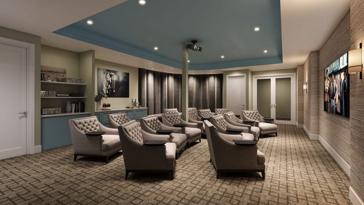 Interior seating area with comfortable chairs and a projector