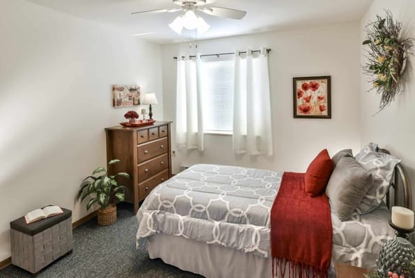 Cozy private room with a bed and decorative elements