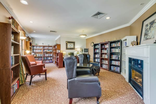 Cozy common area with bookshelves and seating