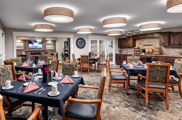 Elegant dining room with tables set for meals.