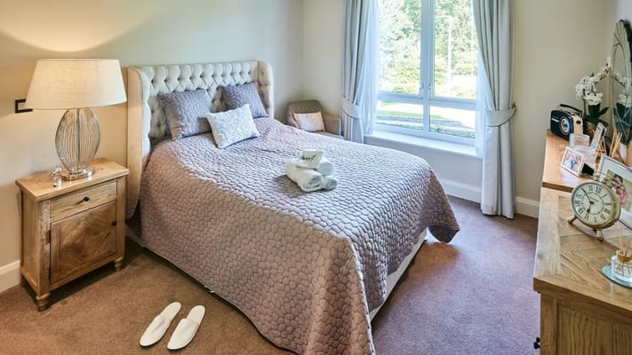 Well-decorated private resident room with natural light