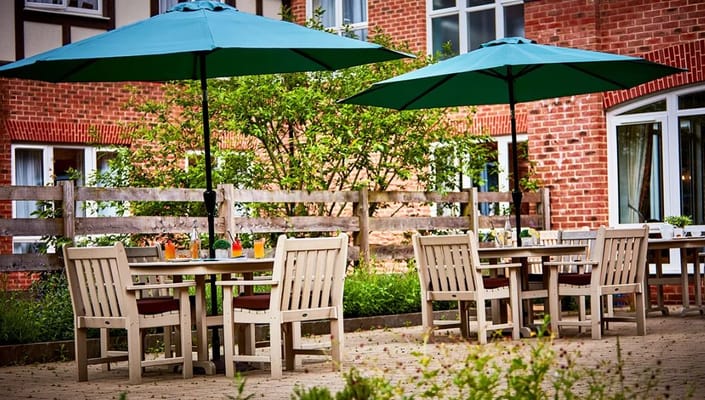 Outdoor seating area with umbrellas and tables