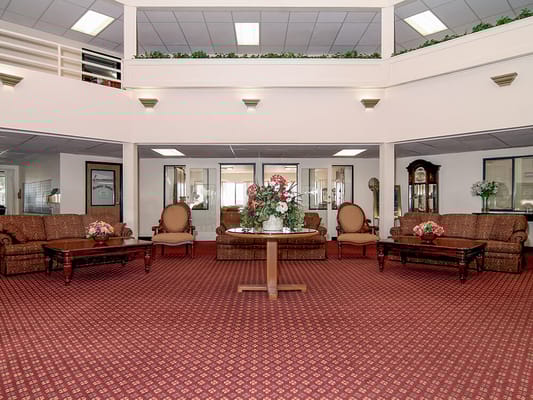 Interior common area with seating and floral arrangements