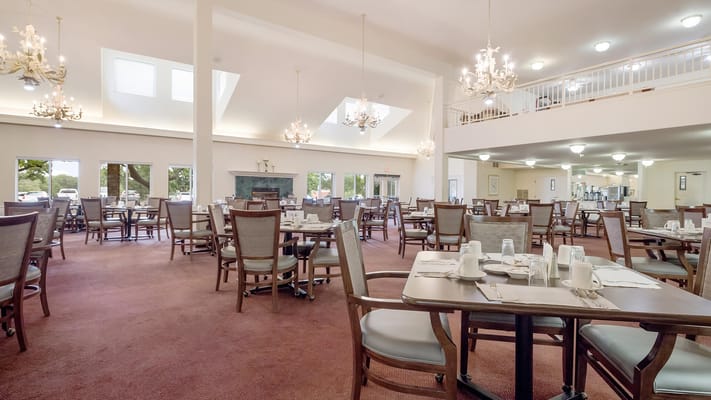 Interior view of a spacious dining room with tables