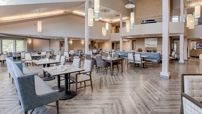 Bright dining room with modern furnishings and ample seating