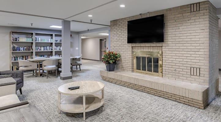 Common area with seating and a fireplace