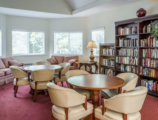 Cozy common area with bookshelves and seating