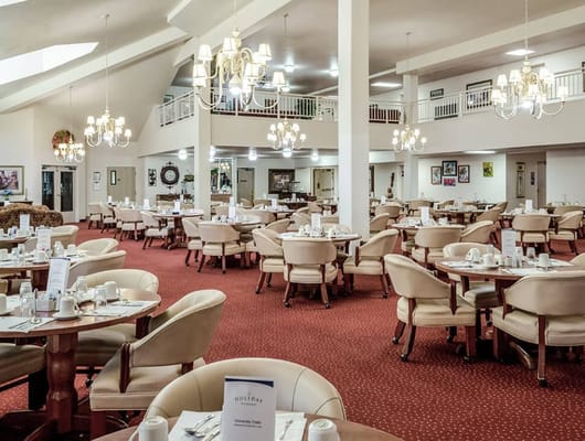 Dining area set up with tables and chairs