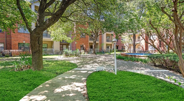 Pathway through landscaped outdoor space at the facility