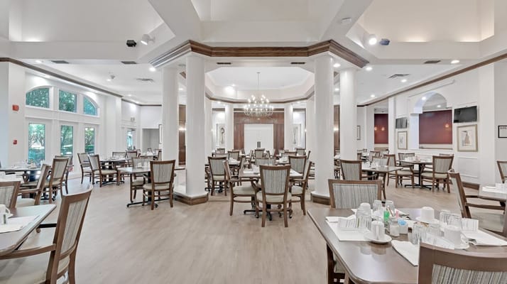 Bright and spacious dining room with tables