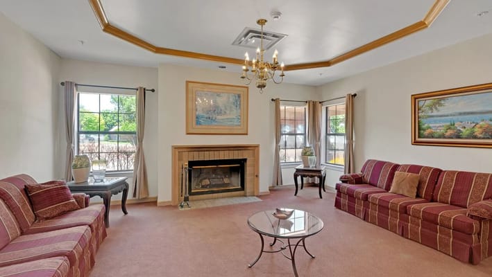 Interior view of a common area with sofas and a fireplace