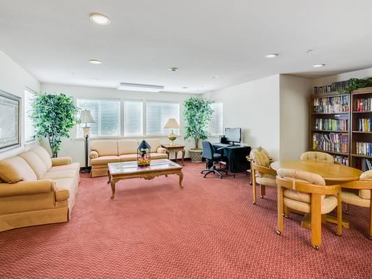 Common area with seating and bookshelves