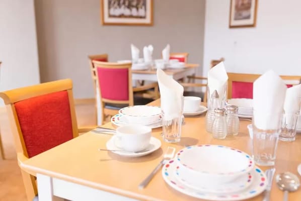 Dining table set with dishes and glasses