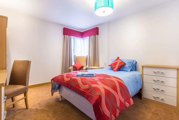 Cozy resident room with colorful bedding and decor