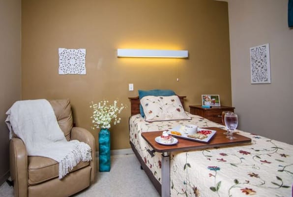 Cozy private room with a bed and refreshments