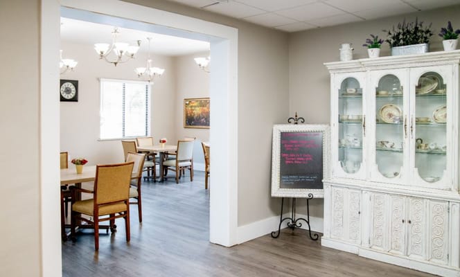 Interior view of a dining area with tables and chairs